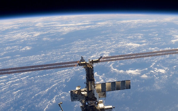 Aft - zenith view of the ISS taken during STS-110's undocking and final flyaround