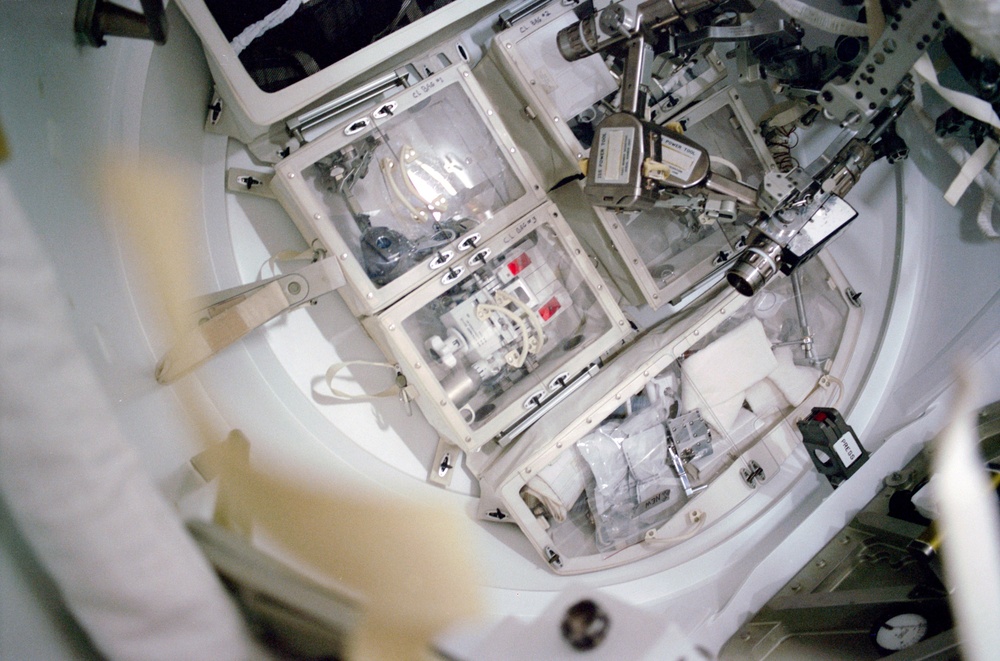 View of an EMU harness and equipment in the Airlock during STS-110