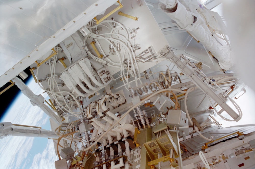 View of the aft avionics tray between the Z1 and S0 Trusses taken during the fourth EVA of STS-110