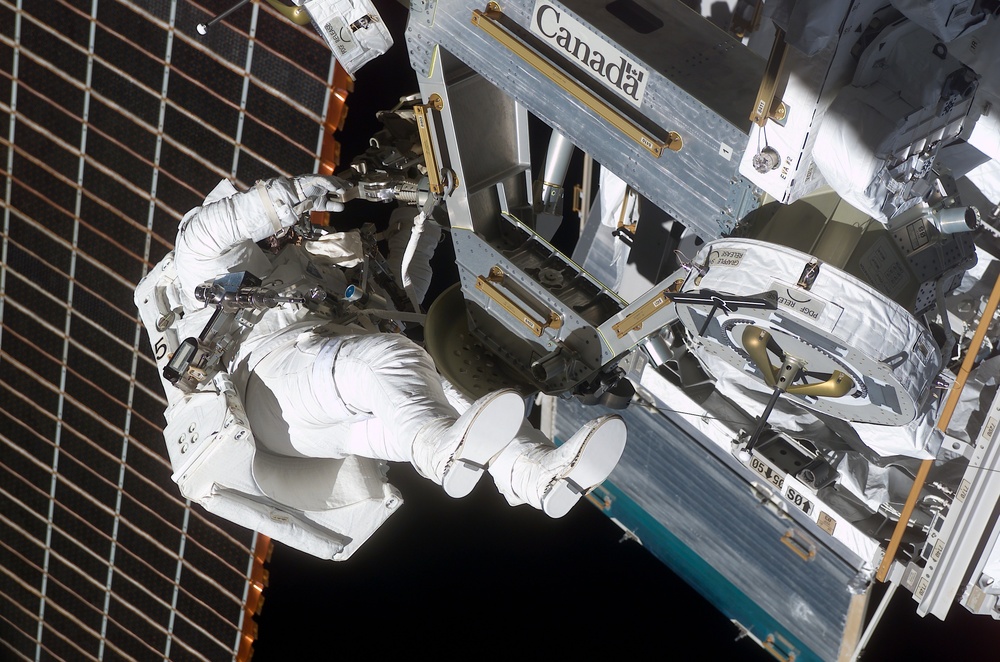 Perrin installs the MBS to the Mobile Transporter railcar during STS-111 UF-2 EVA 2
