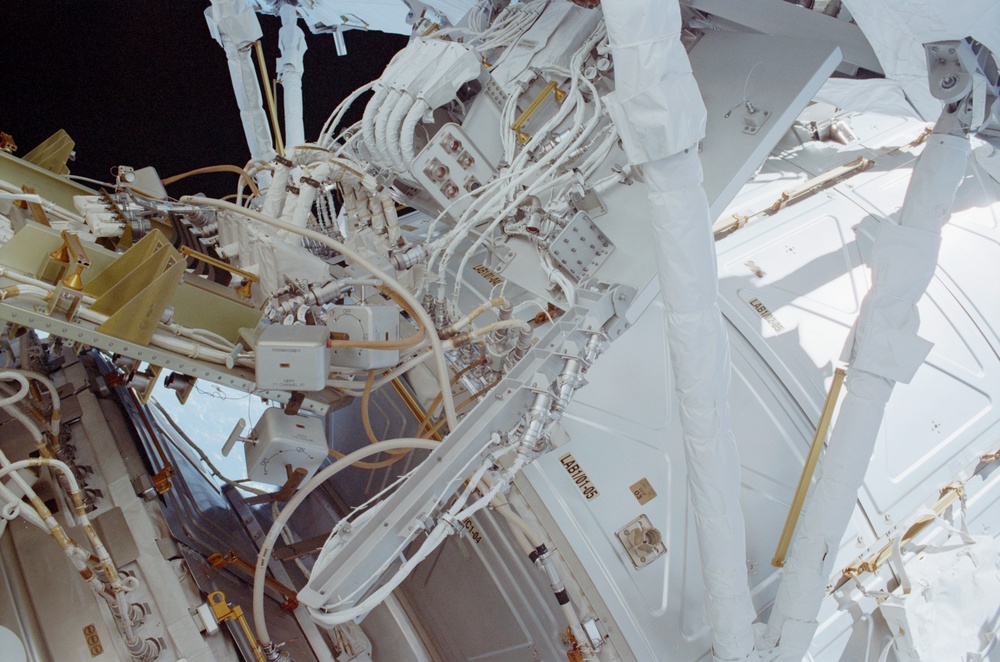 View of the aft avionics tray between the Z1 and S0 Trusses taken during the fourth EVA of STS-110