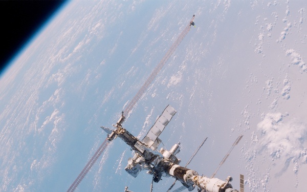 Aft - zenith view of the ISS taken during STS-110's undocking and final flyaround