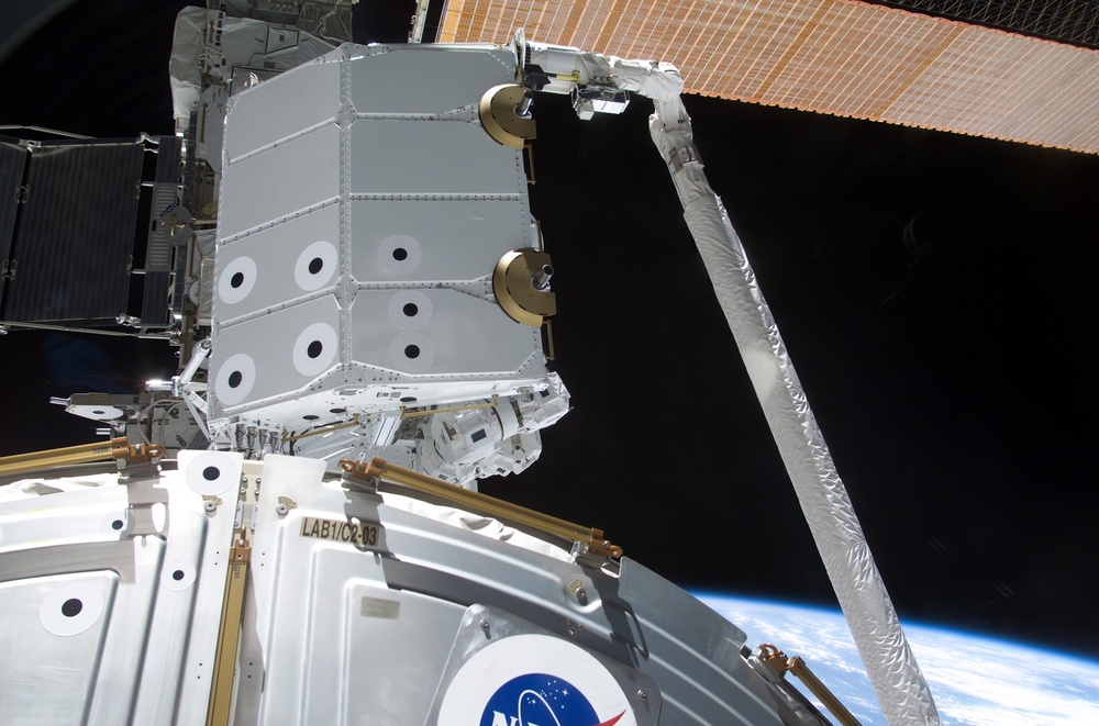 View of the RMS grappling the Spacelab Pallet during STS-100