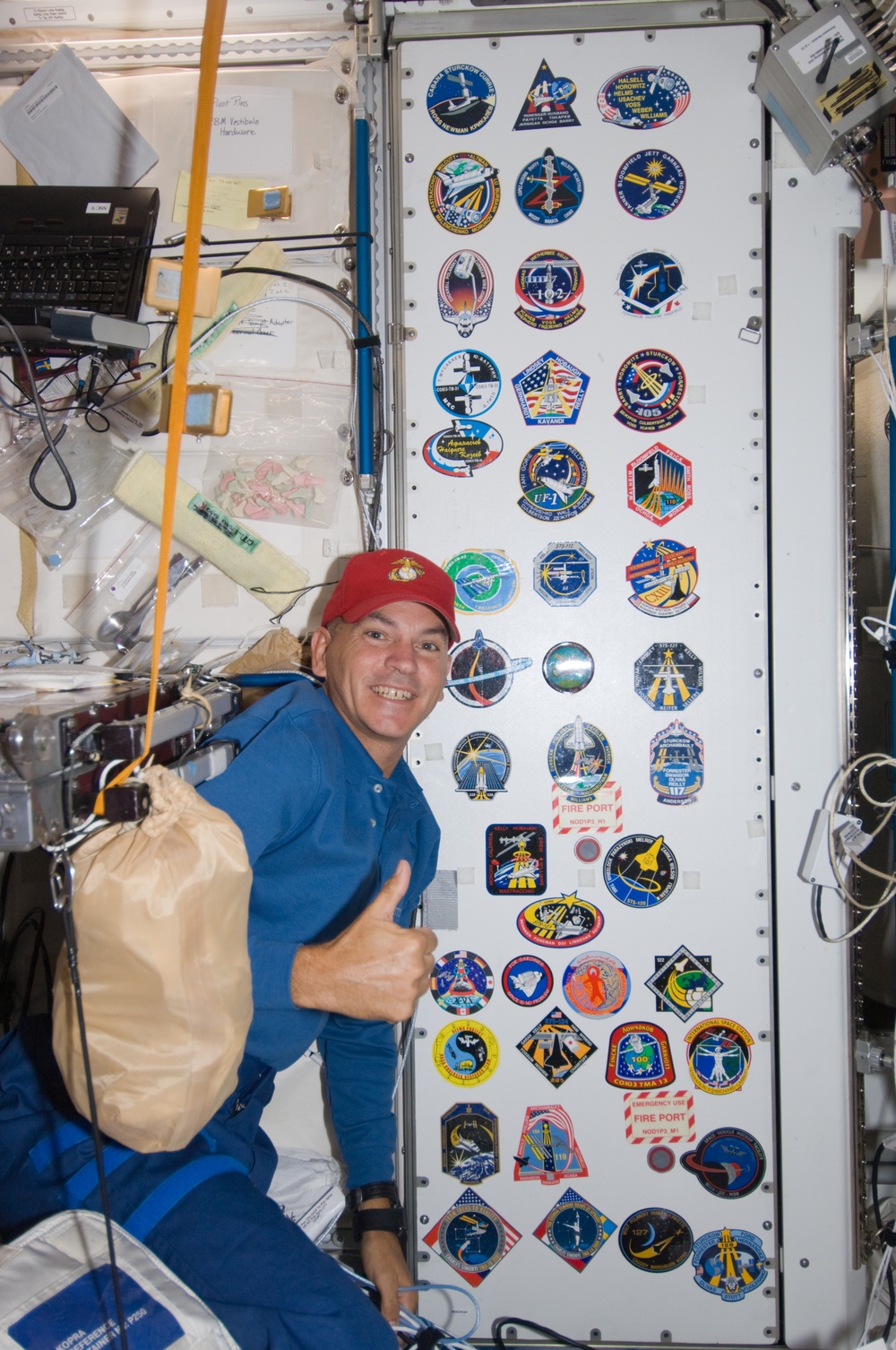 Crew poses at patch wall in Node 1