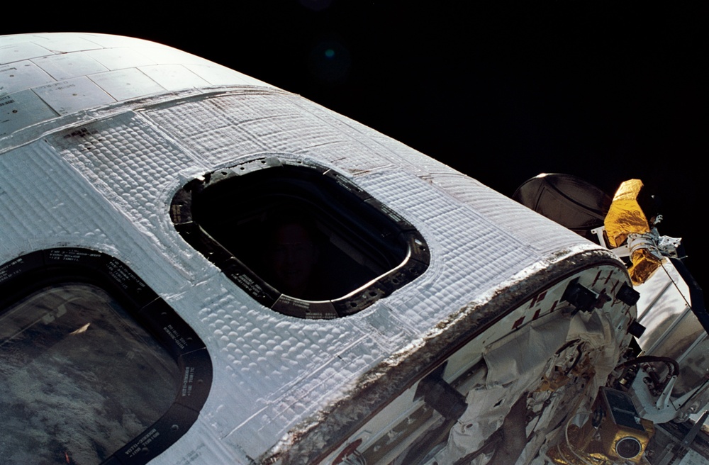 Cdr. Richards seen through a payload bay window