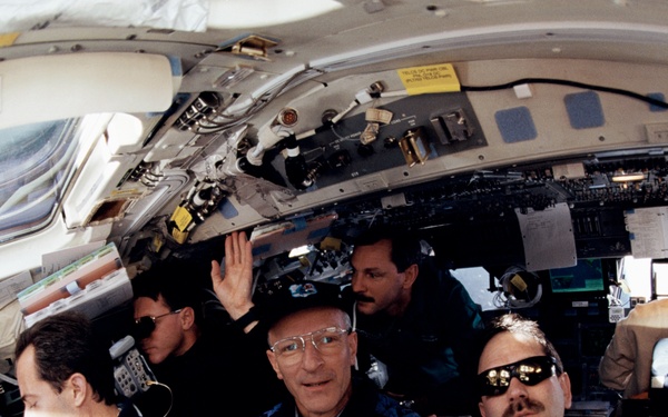 Various view with fish-eye lens of STS-103 crew on aft flight deck