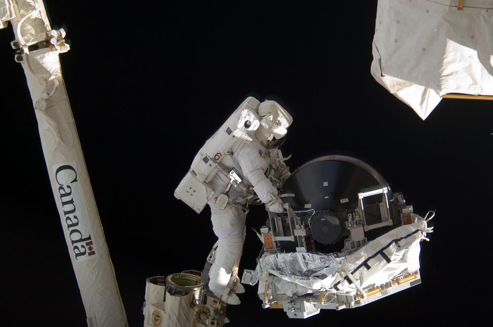 View of MS Williams transporting the new CMG to the ESP2 during EVA 2