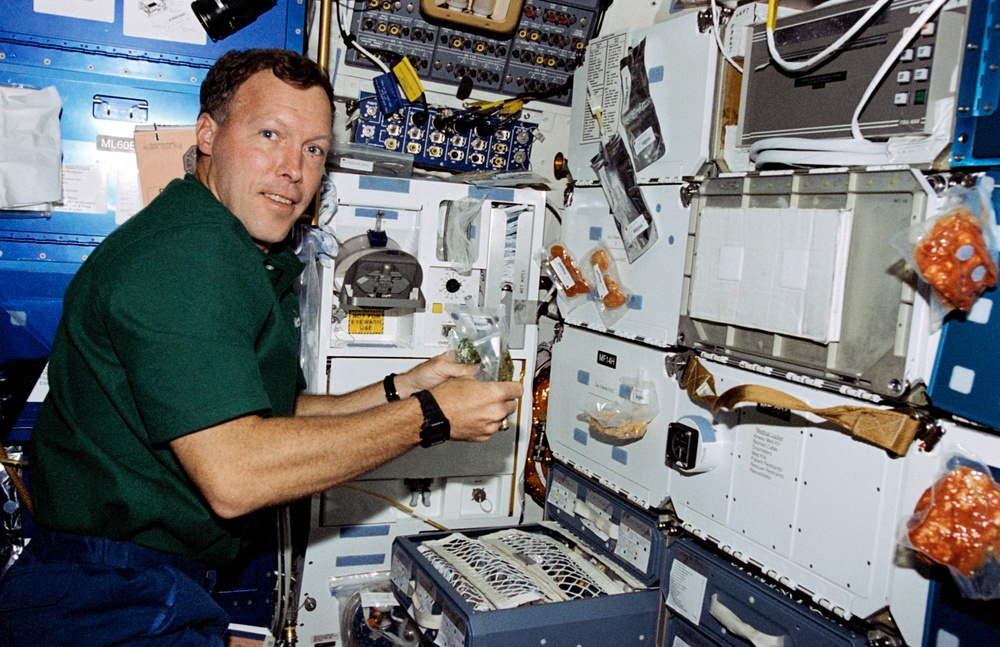 Crewmember activity in the orbiter middeck