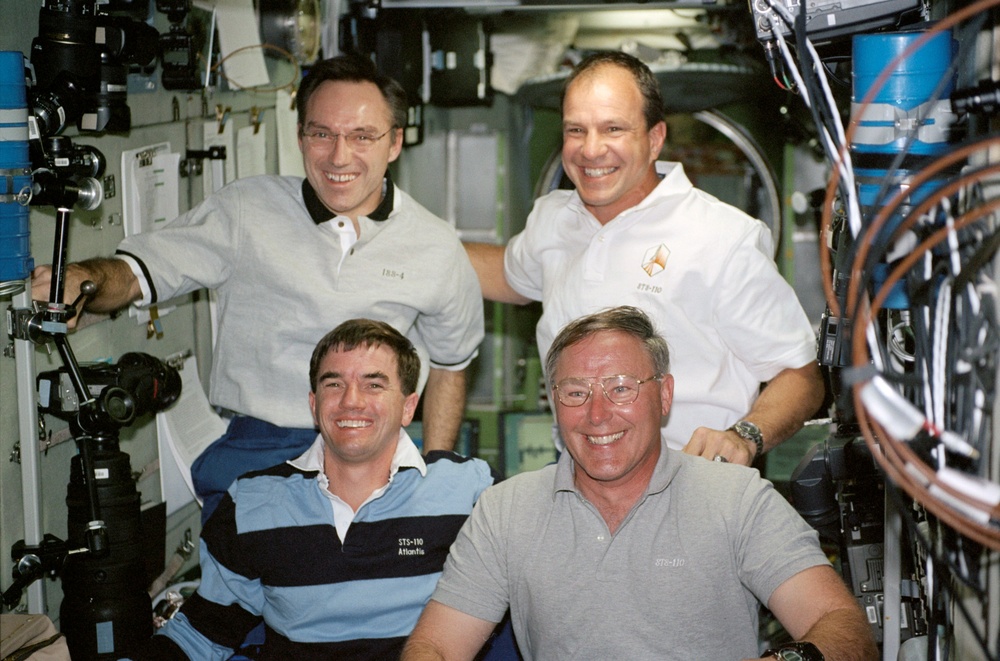 Walz, Bloomfield, Walheim and Ross pose in the Service Module during STS-110