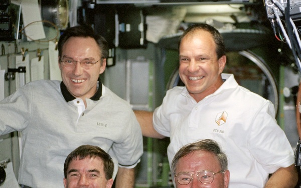 Walz, Bloomfield, Walheim and Ross pose in the Service Module during STS-110