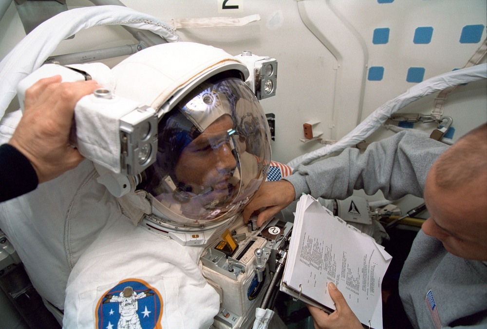 Various views of preparation for one of the STS-88 EVAs