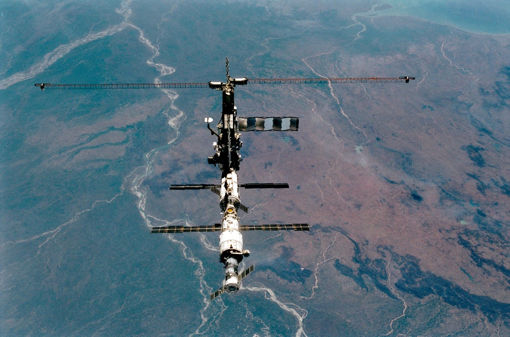 Various views of the ISS during flyaround backdropped by the Earth