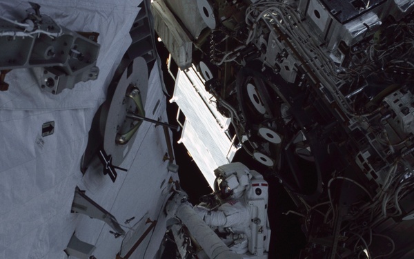 MS Ross works on the aft port struts for the S0 Truss during the second EVA of STS-110