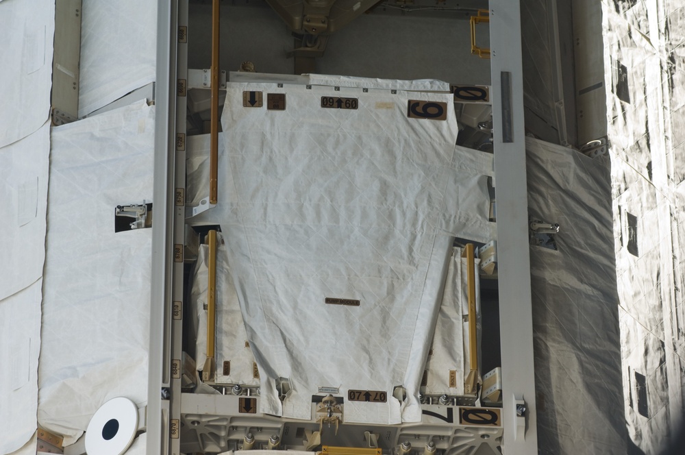 Survey view of the Pump Module on the S1 Truss during Joint Operations