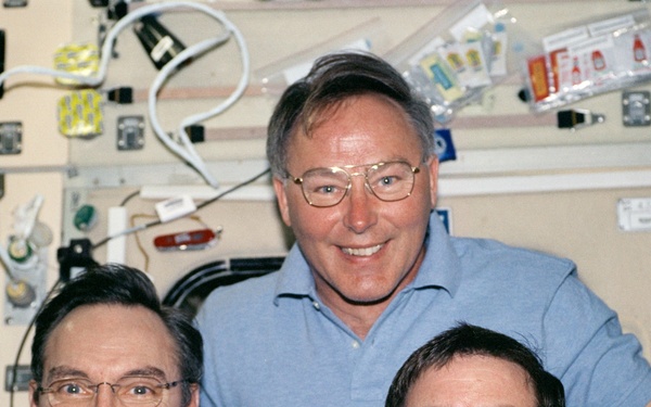 Walz, Ross and Walheim pose in the Service Module during STS-110