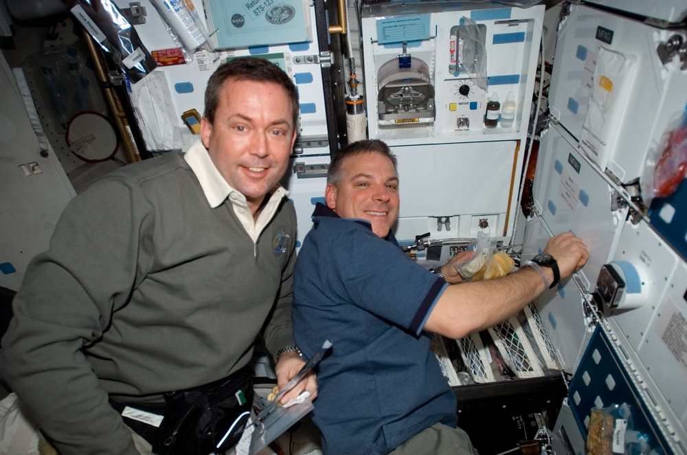 Foreman and Johnson in the Middeck MDDK during STS-123 / Expedition 16 Joint Operations