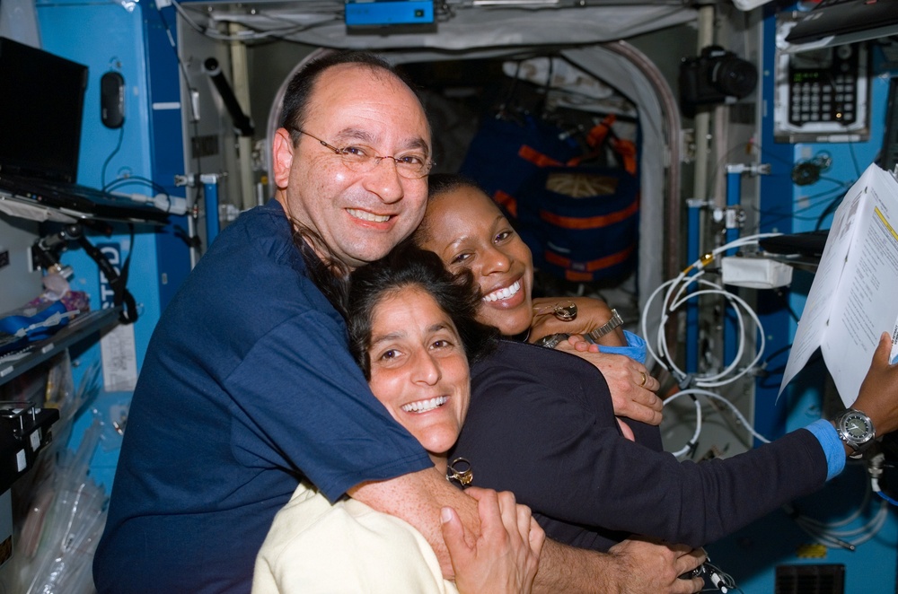 Polansky, Higginbotham, and Williams pose in the U.S. Laboratory during STS-116