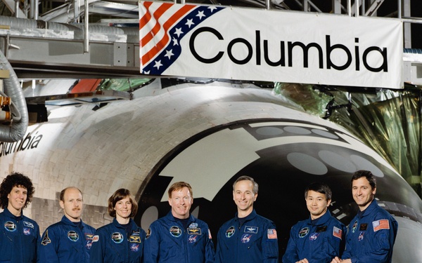 STS-50 USML-1 crew poses for their official portrait in front of OV-102