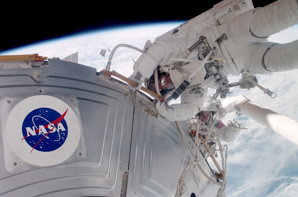 Forrester working with S0 cables on the LAB during EVA2