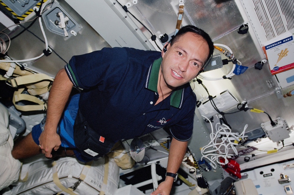 MS Noriega listens to a CD player on the middeck during STS-97