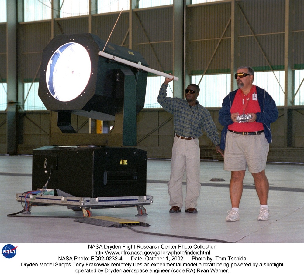 Dryden Model Shop's Tony Frakowiak remotely flies an experimental model aircraft being powered by a