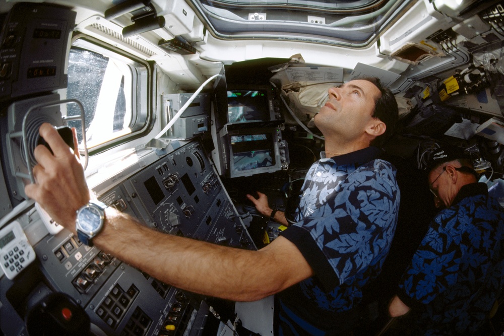 Various view with fish-eye lens of STS-103 crew on aft flight deck