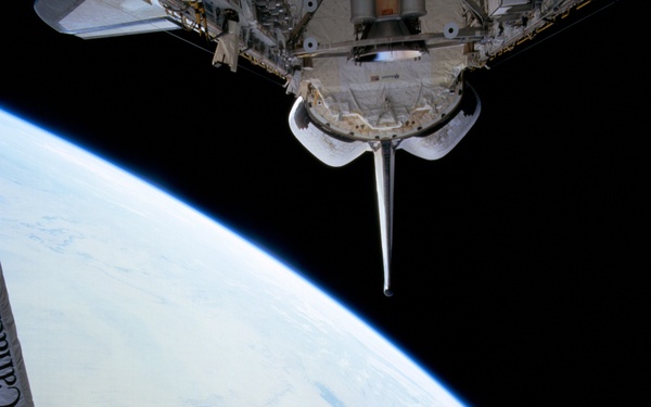 WSF, view of satellite on RMS arm during deployment procedures