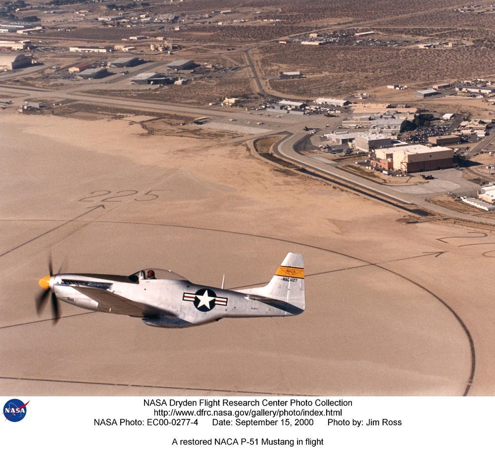 A restored NACA P-51 Mustang in flight