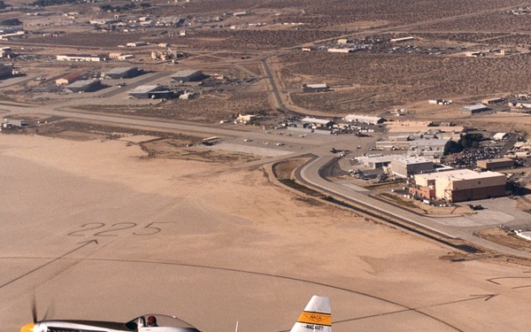 A restored NACA P-51 Mustang in flight