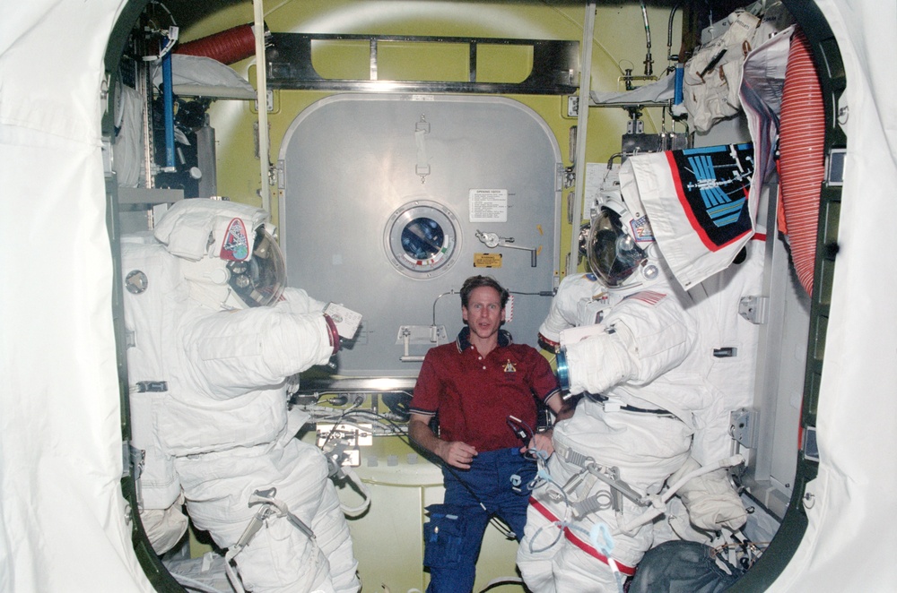STS-104 MS Gernhardt in Quest airlock