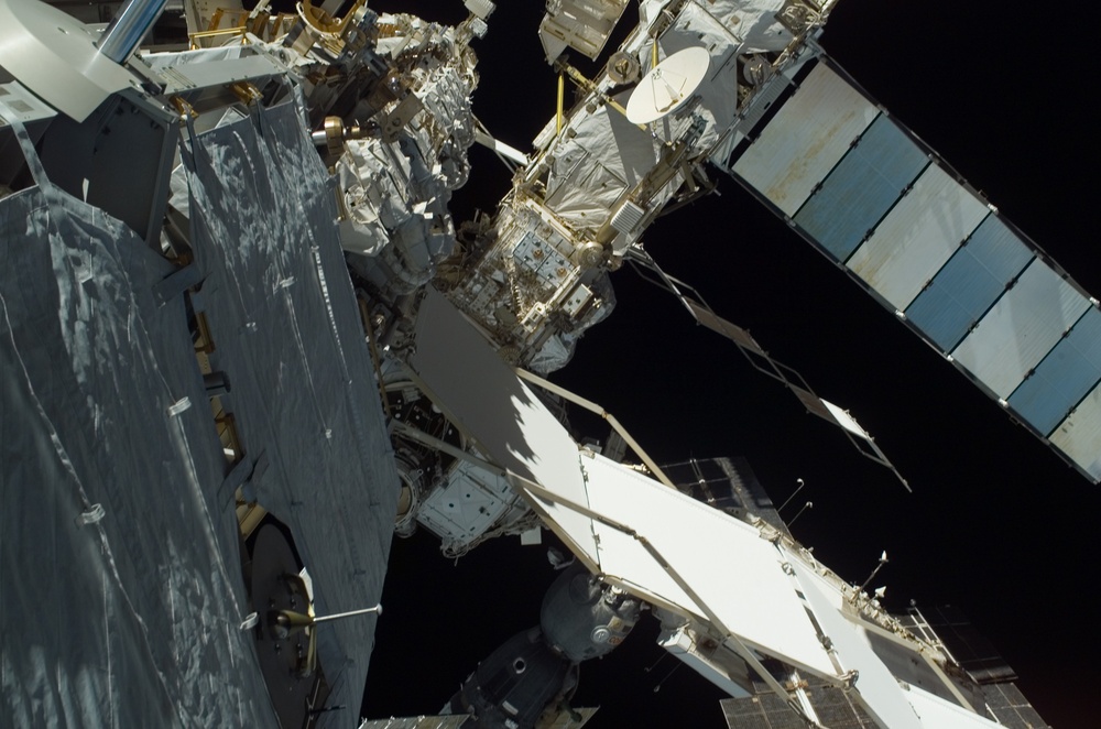 EVA view of the P1 Truss aft radiator and port side of the P6 Truss and Z1 Truss during STS-115 mission