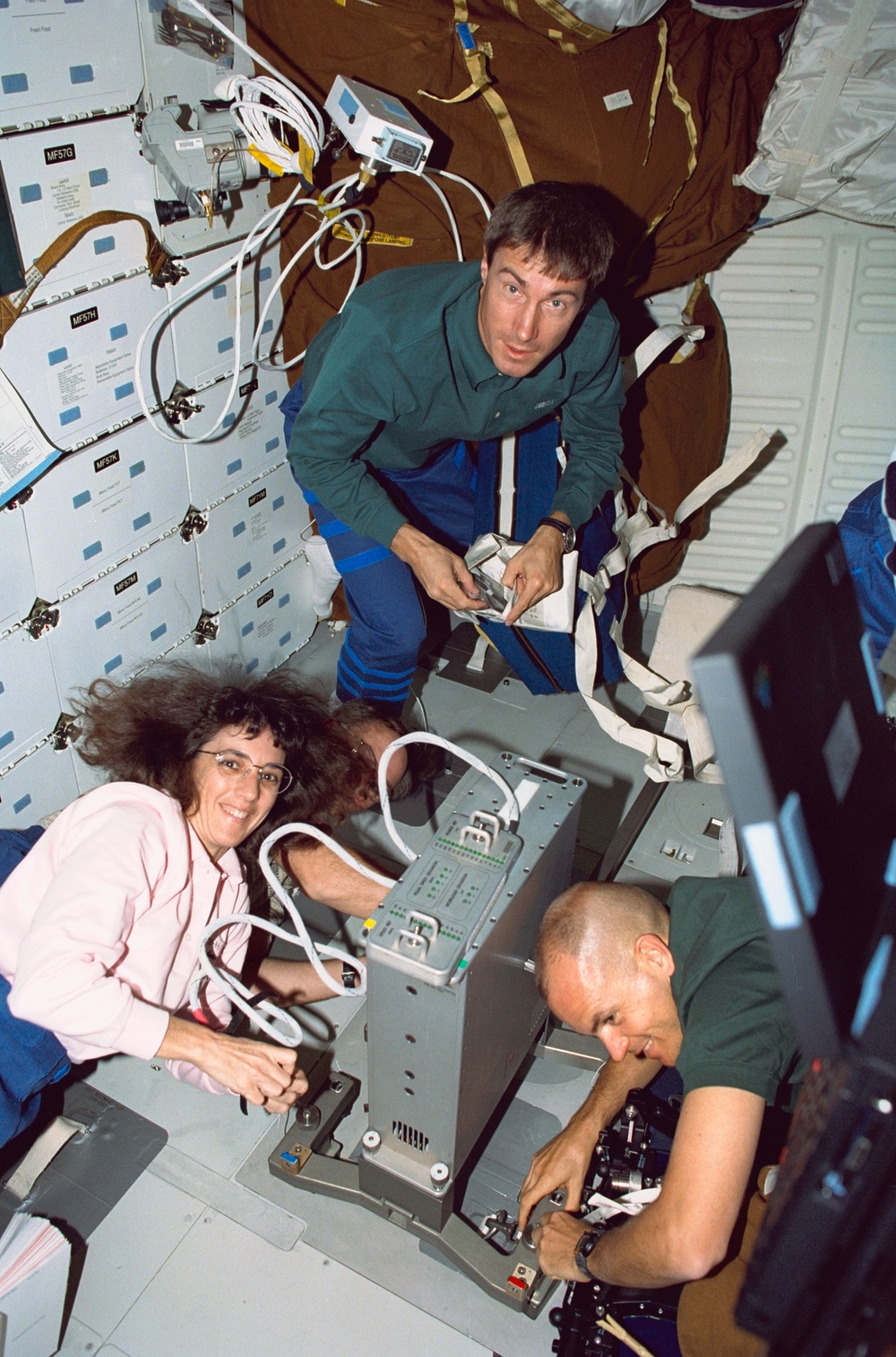 Various views of the STS-88 crew on the flight deck and middeck