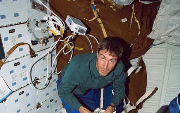 Various views of the STS-88 crew on the flight deck and middeck