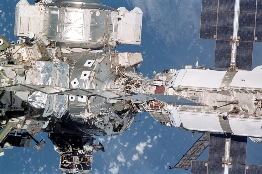 Exterior view of ISS during flyaround by STS-105 showing Node 1, PMA1 and FGB