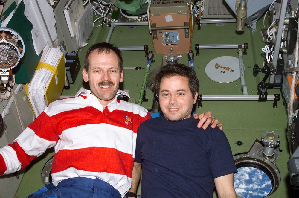 Bursch and Smith pose in Zvezda during STS-110's visit to the ISS