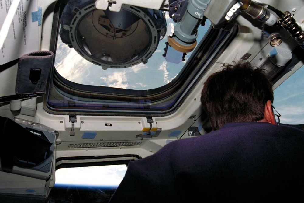 MS Rominger at aft flight deck controls during docking