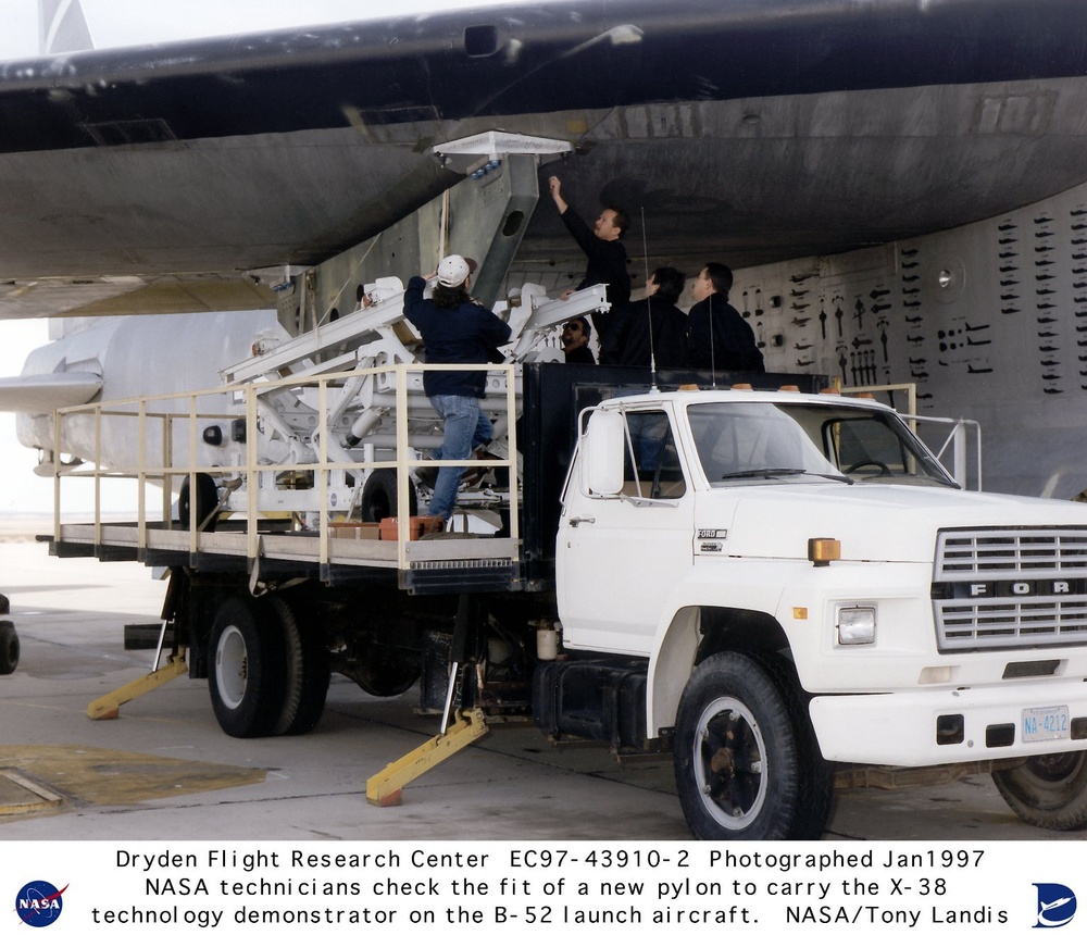 Close-up of Wing Fit Check of Pylon to Carry the X-38 on B-52 Launch Aircraft
