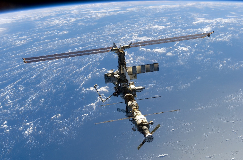 Aft - zenith view of the ISS taken during STS-110's undocking and final flyaround