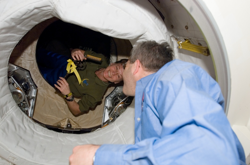 Whitson greets Frick after Docking