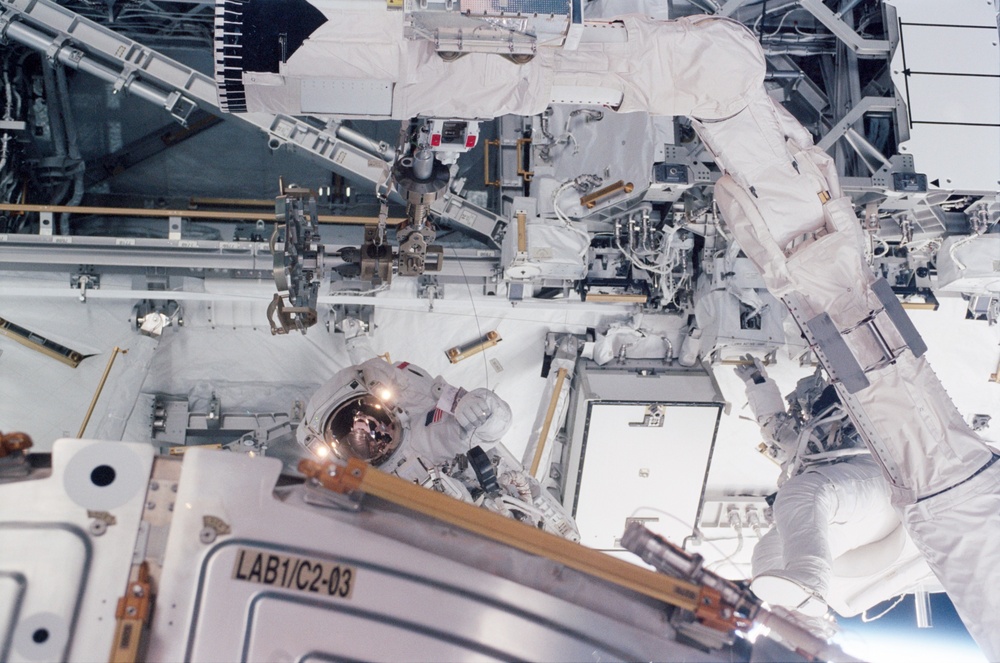 MS Walheim and MS Smith at work during the third EVA of STS-110