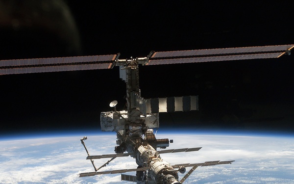 Aft - zenith view of the ISS taken during STS-110's undocking and final flyaround