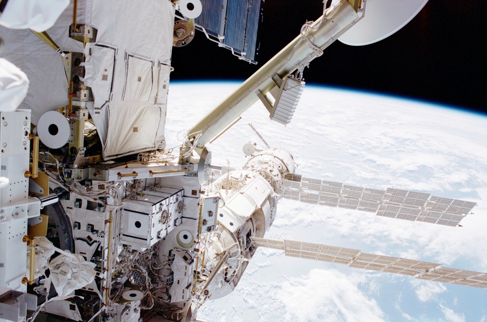 View of the port side of the Z1 Truss, Zarya and Zvezda taken during the first EVA of STS-100