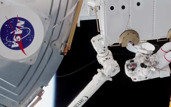 MS Hadfield works on the SLP during an EVA for STS-100