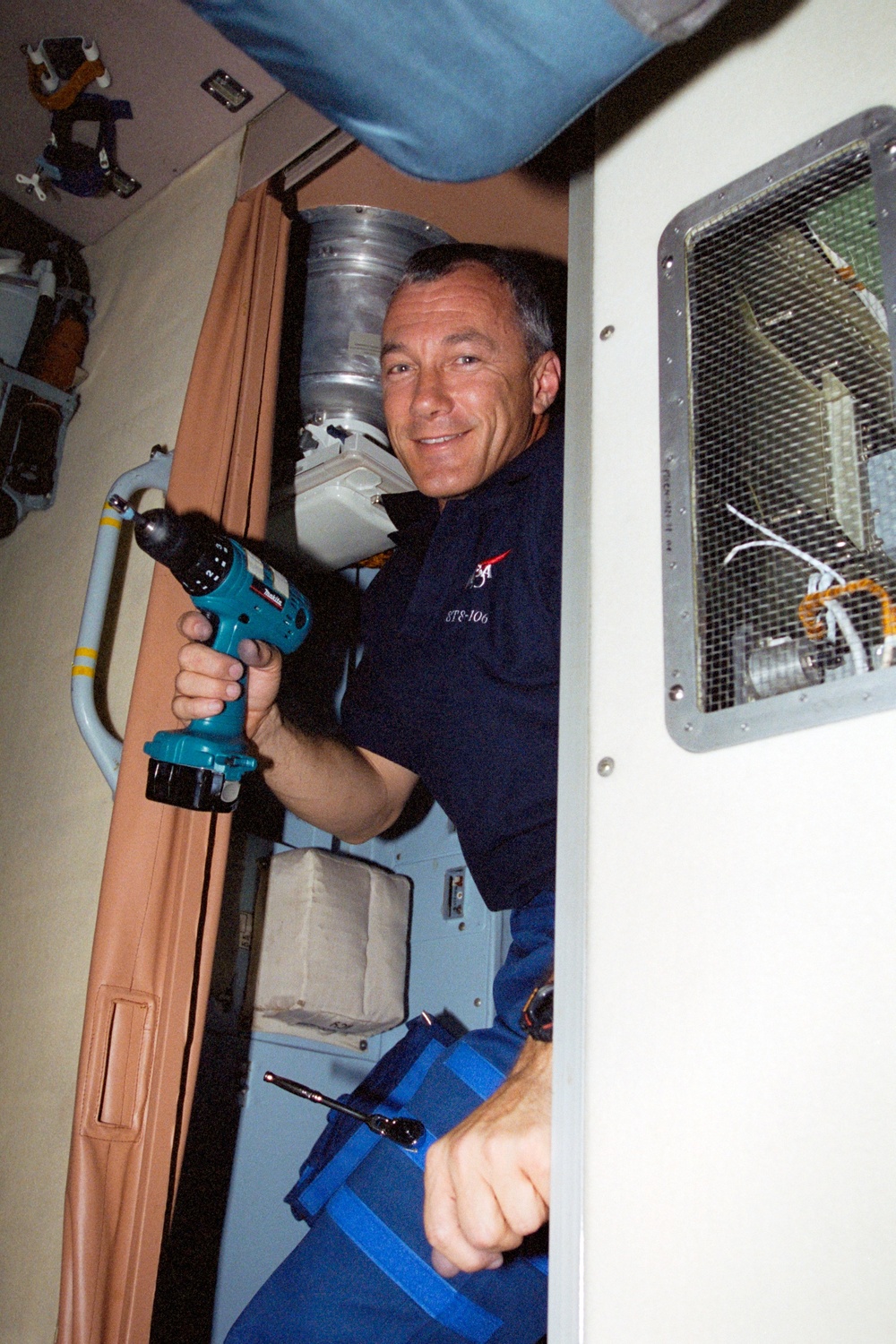 Commander Wilcutt removes restraining bolts in Zvezda during STS-106