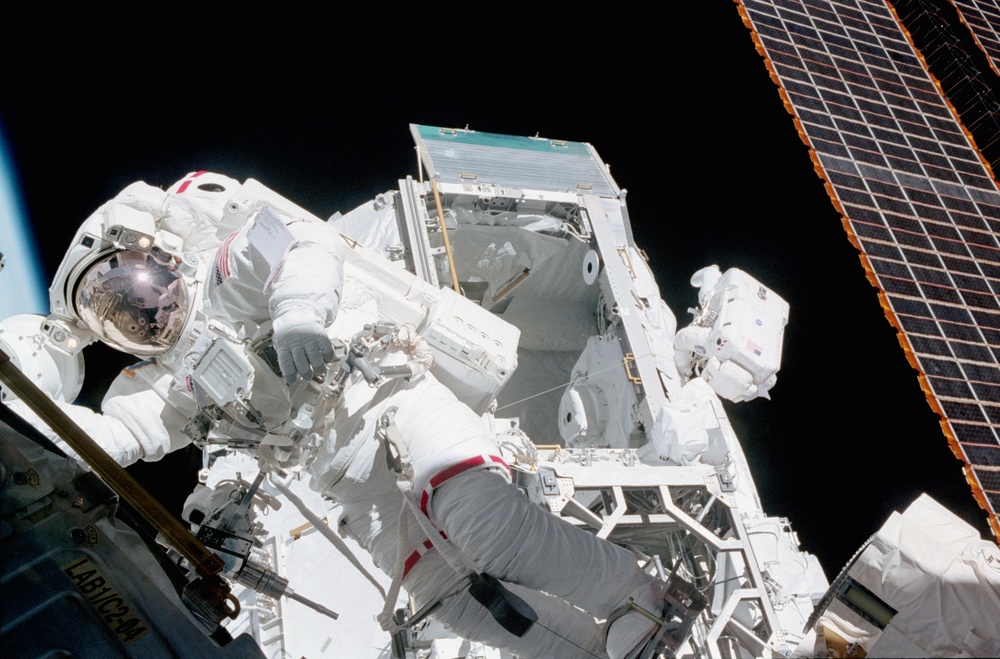 MS Ross and MS Morin at work during the fourth EVA of STS-110