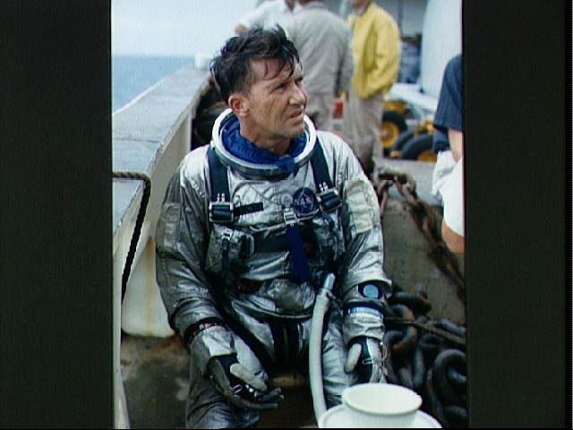 Astronaut Walter Schirra suiting up during water egress training