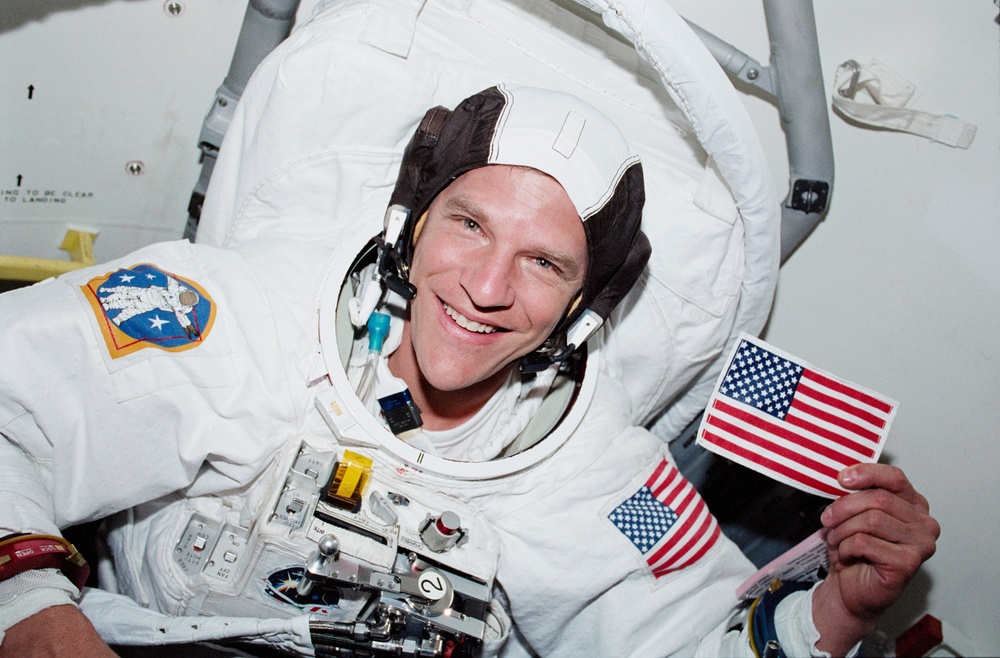 MS Parazynski poses in his EMU in Endeavour's airlock during STS-100