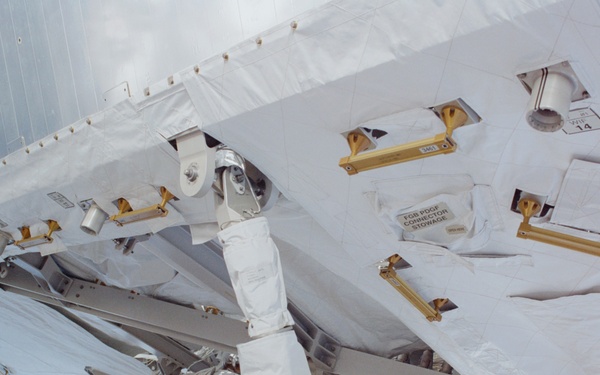 View of the aft avionics tray between the Z1 and S0 Trusses taken during the fourth EVA of STS-110