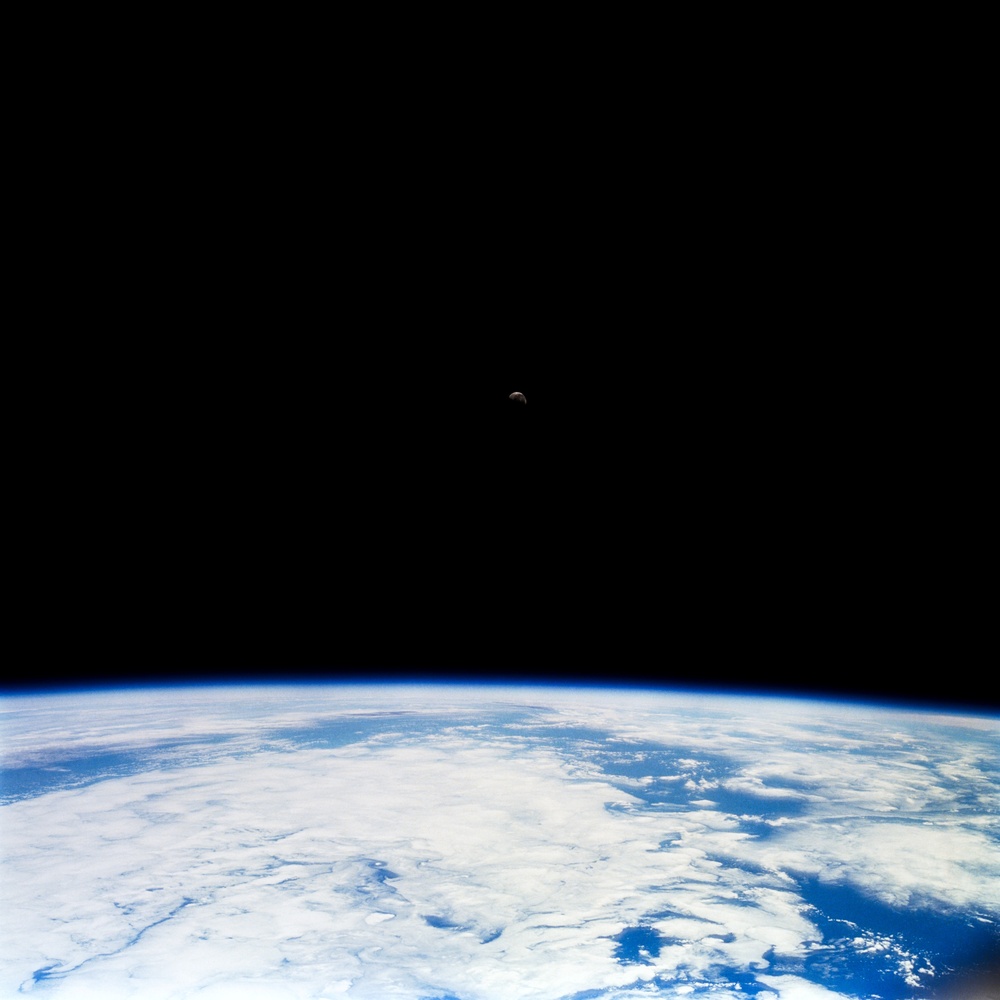 Earth observations of the Moon over an Earth limb taken during STS-108