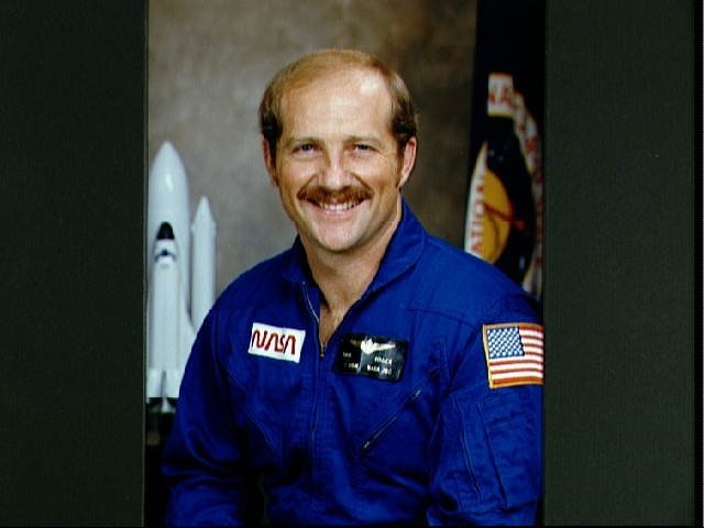 Portrait of Astronaut candidate Frederick H. Hauck in blue flight suit.